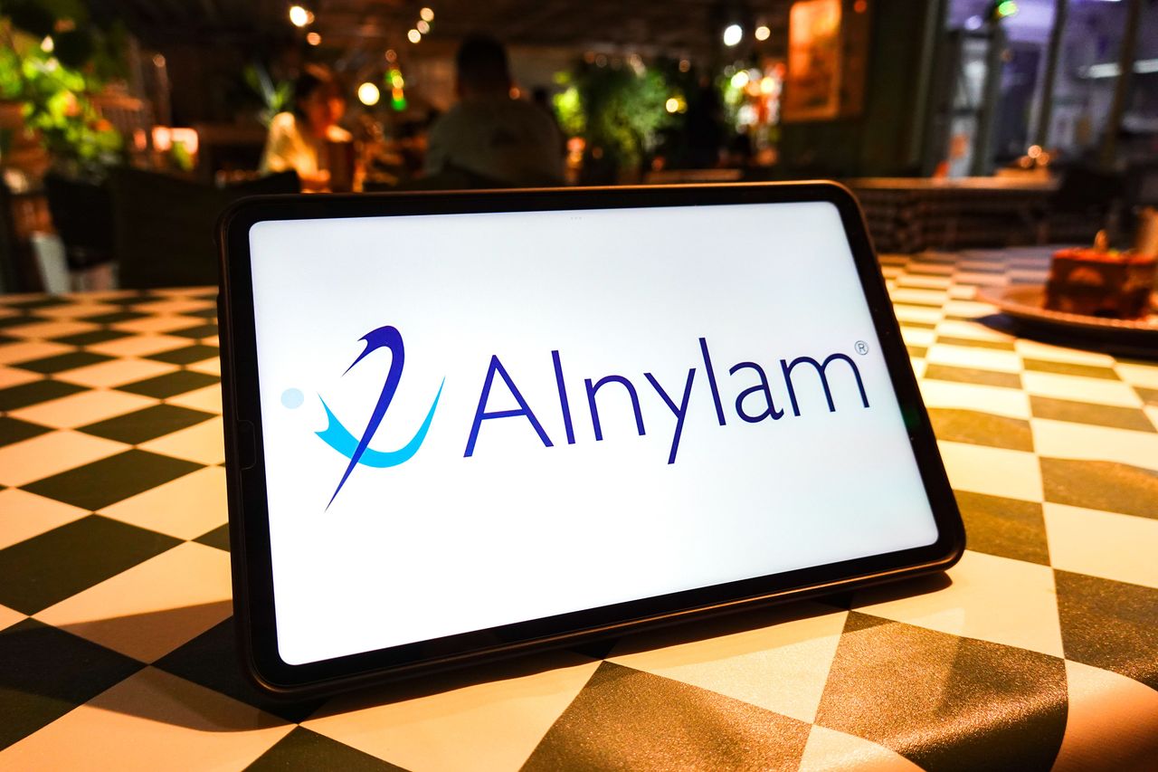In this photo illustration, the Alnylam Pharmaceuticals logo is seen displayed on the screen of a tablet. (Photo Illustration by Sheldon Cooper/SOPA Images/LightRocket via Getty Images)