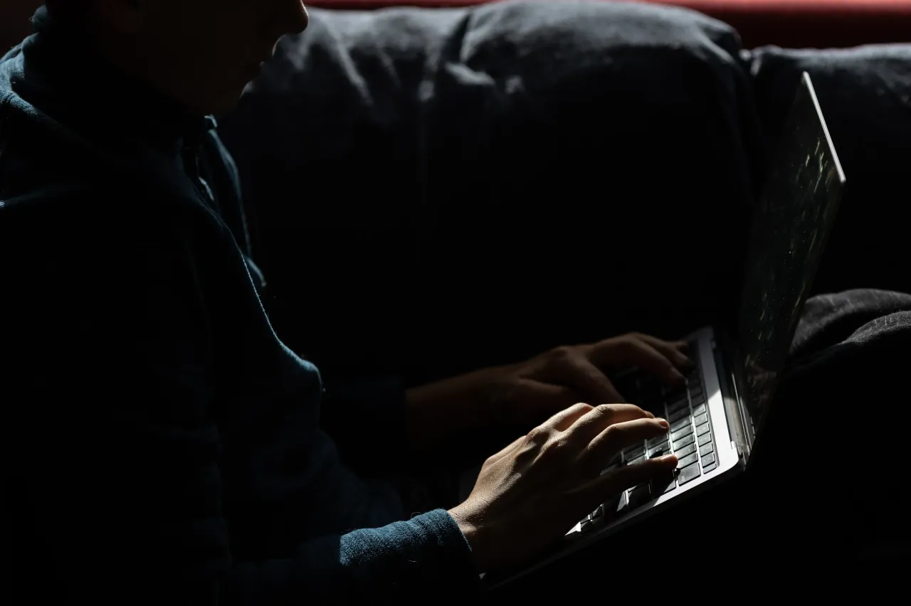 A 13-year-old boy looks at a laptop screen on October 05, 2025 in Penzance, England. (Photo by Matt Cardy/Getty Images)