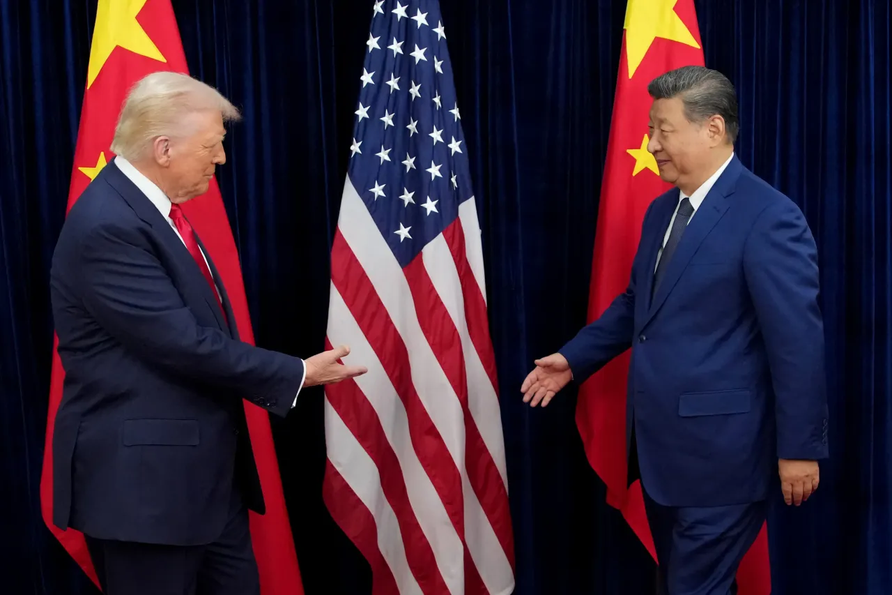 U.S. President Donald Trump greets Chinese President Xi Jinping ahead of a bilateral meeting at Gimhae Air Base on October 30, 2025 in Busan, South Korea. (Photo by Andrew Harnik/Getty Images)
