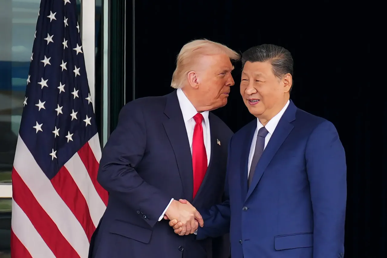U.S. President Donald Trump and Chinese President Xi Jinping shake hands as they depart following a bilateral meeting at Gimhae Air Base on October 30, 2025 in Busan, South Korea. 