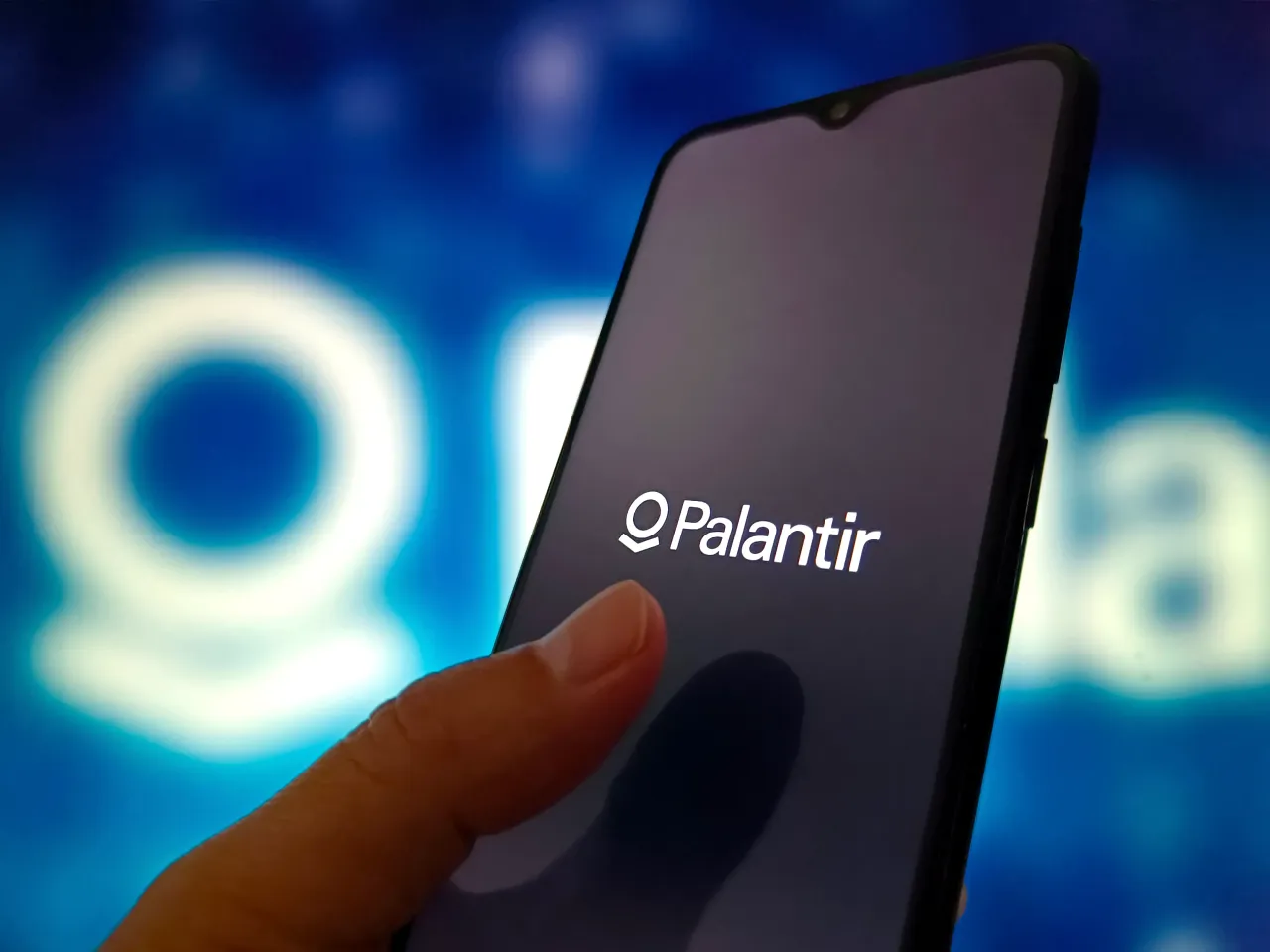 An illustration photo shows Palantir logo in a smartphone. (Photo credit should read CFOTO/Future Publishing via Getty Images)