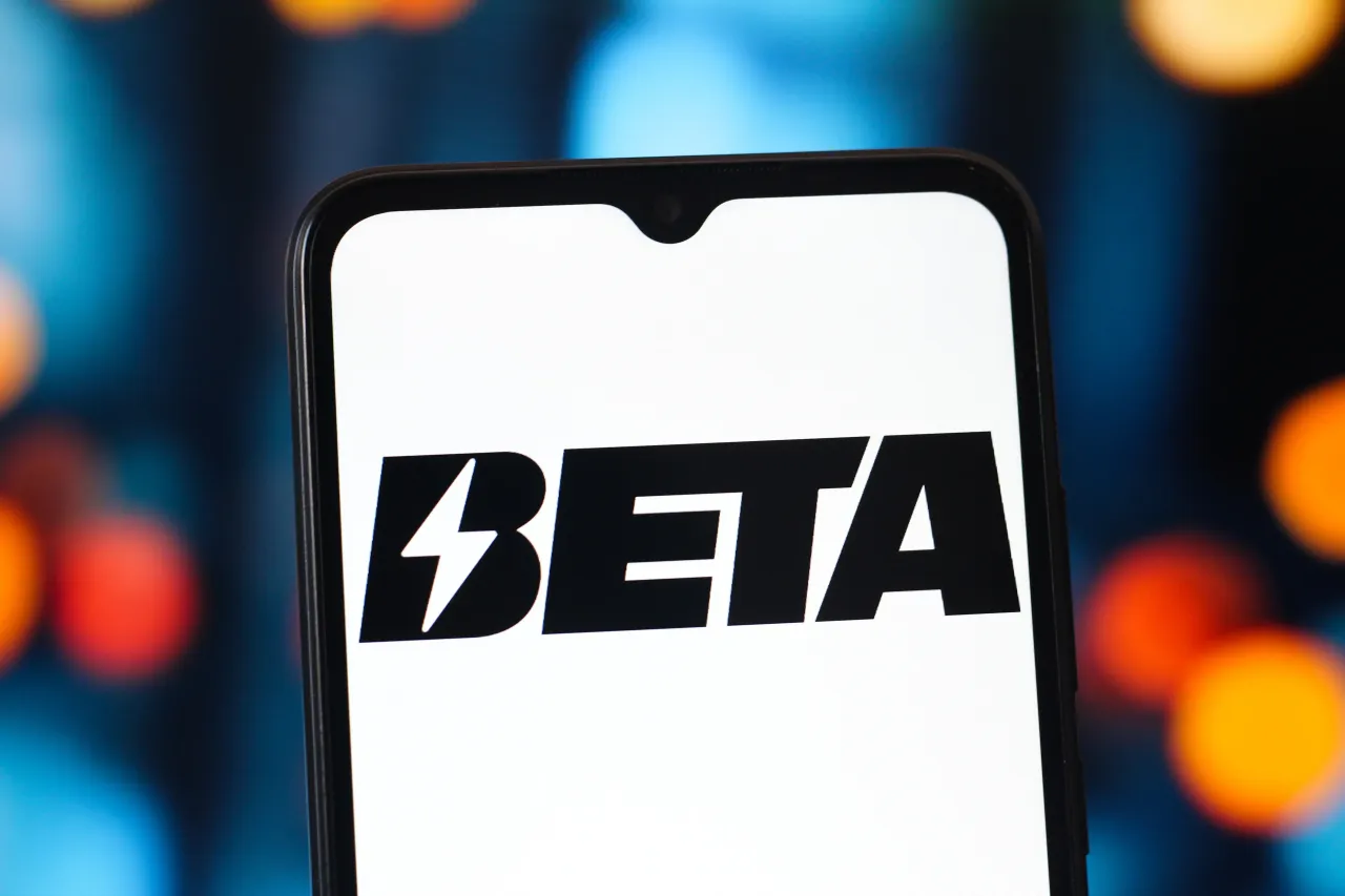 In this photo illustration, the Beta Technologies logo is seen displayed on a smartphone screen. (Photo Illustration by Thomas Fuller/SOPA Images/LightRocket via Getty Images)