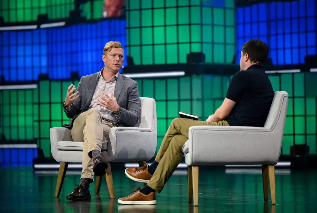 Andrew Macdonald, President & COO, Uber, and Craig Trudell, Global Automotive Editor, Bloomberg, on Centre stage during day one of Web Summit 2025 at the MEO Arena in Lisbon, Portugal. (Photo By Alex Broadway/Sportsfile for Web Summit via Getty Images)