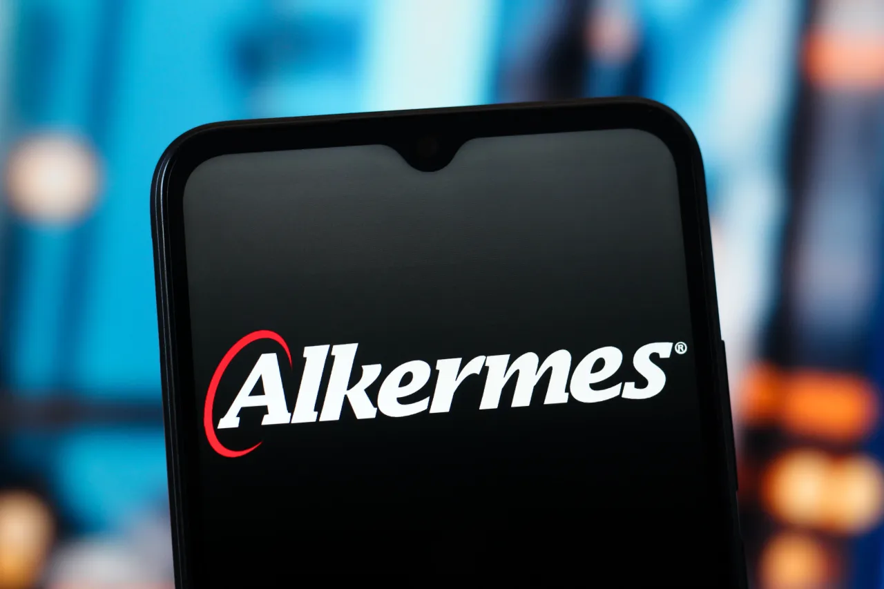 In this photo illustration, the Alkermes logo is seen displayed on a smartphone screen. (Photo Illustration by Thomas Fuller/SOPA Images/LightRocket via Getty Images)