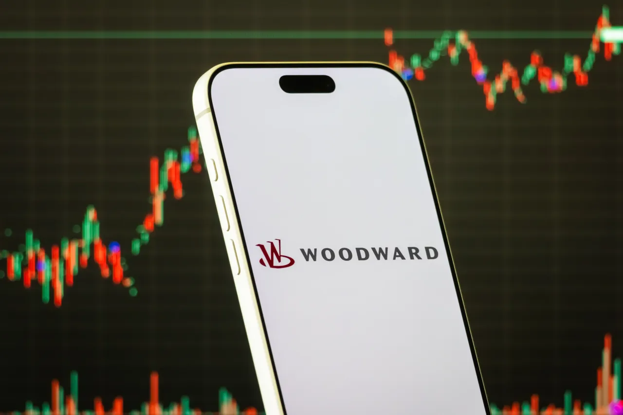 In this photo illustration, a smartphone displays the logo of Woodward, Inc.