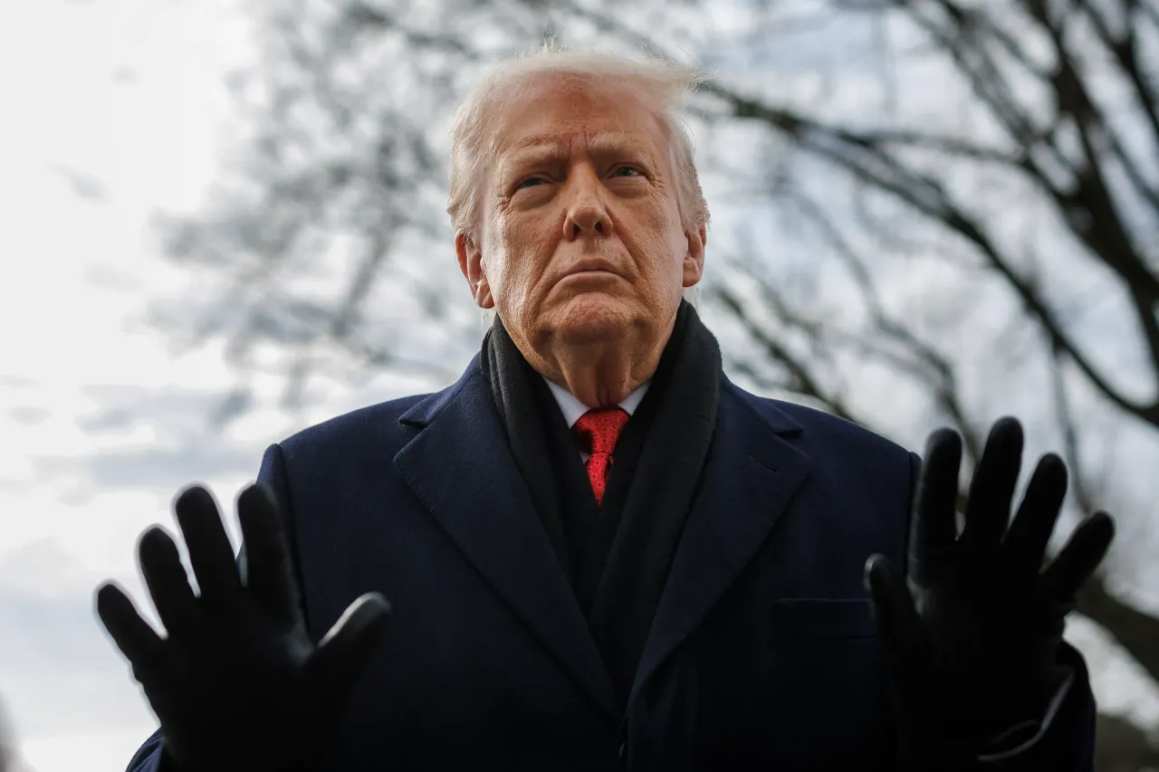 Donald Trump speaks to reporters on the South Lawn before boarding Marine One at the White House on January 16, 2026 in Washington, DC. (Photo by Tom Brenner/Getty Images)