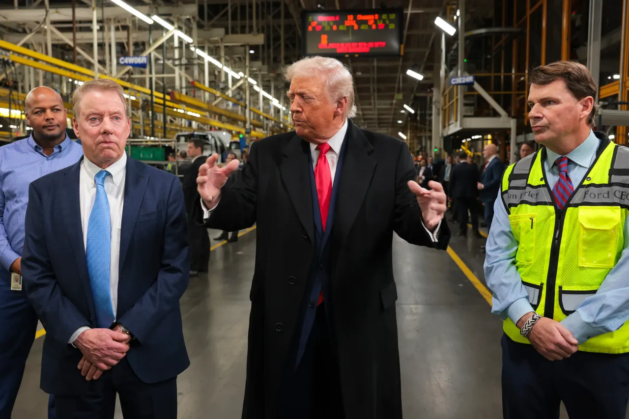 U.S. President Donald Trump (2R) talks with Executive chair of Ford Bill Ford Jr. (2L), and CEO of Ford Jim Farley (R) as they tour the Ford River Rouge Complex on January 13, 2026 in Dearborn, Michigan.  (Photo by Anna Moneymaker/Getty Images)