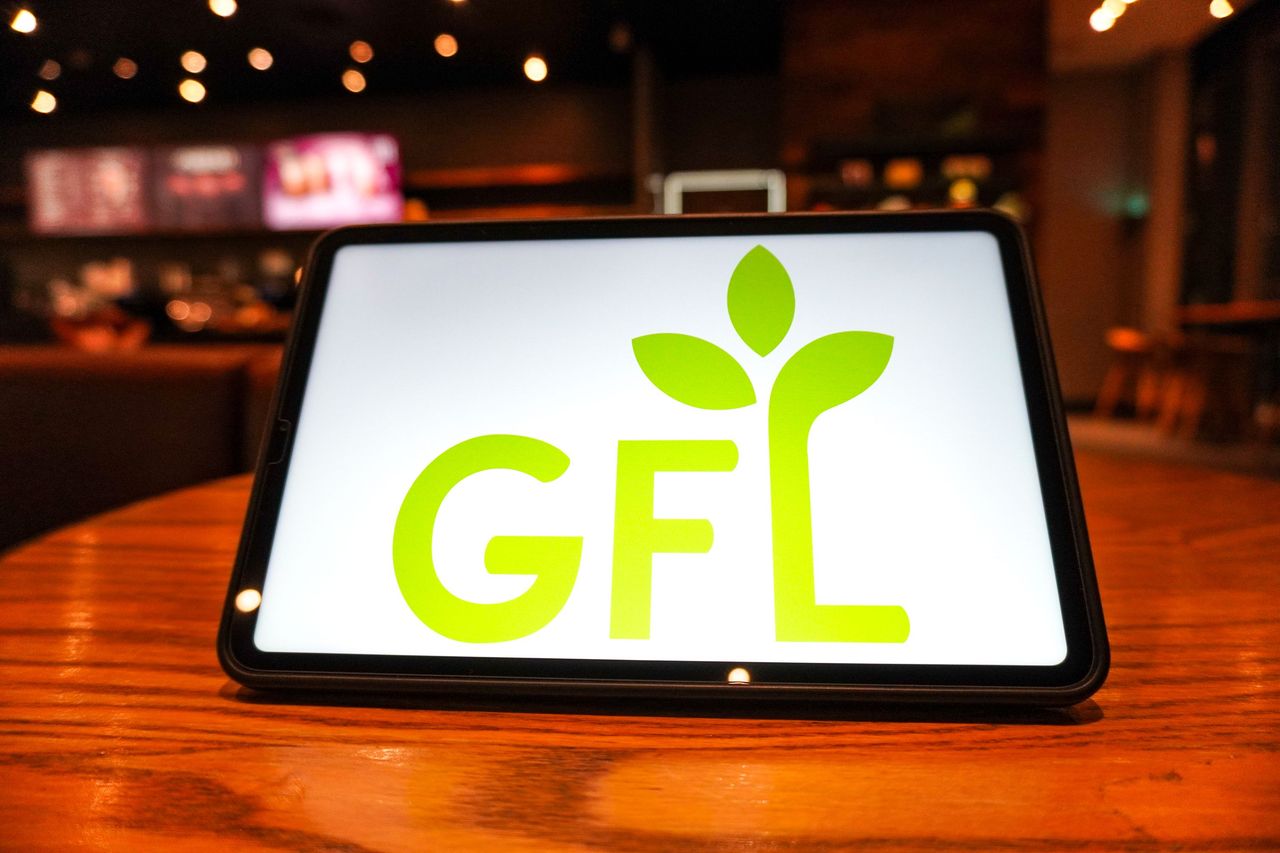 In this photo illustration, the GFL Environmental Inc. logo is displayed on the screen of a tablet. (Photo Illustration by Sheldon Cooper/SOPA Images/LightRocket via Getty Images)