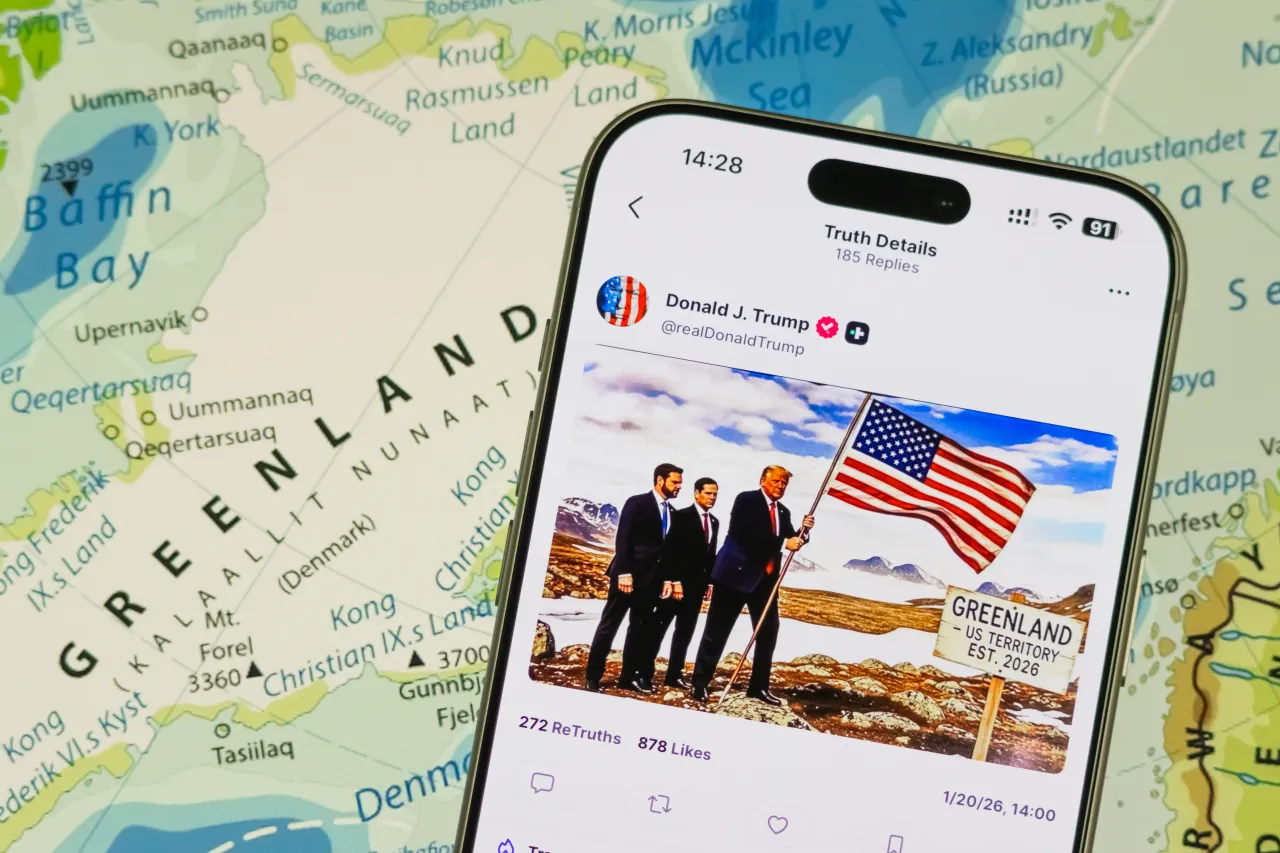 In this photo illustration, a smartphone displays a post by U.S. President Donald Trump on the Truth Social platform posted on January 20, 2026. (Photo illustration by Cheng Xin/Getty Images)