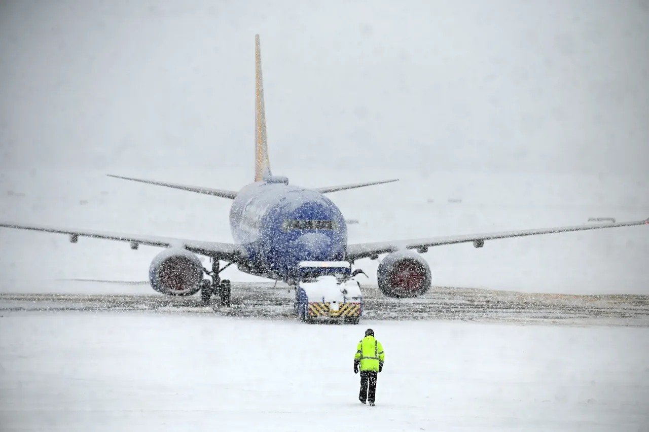 A Southwest jet is prepared for flight during snowy conditions at Albany International Airport on Monday, Jan. 26, 2026, in Colonie, N.Y. 