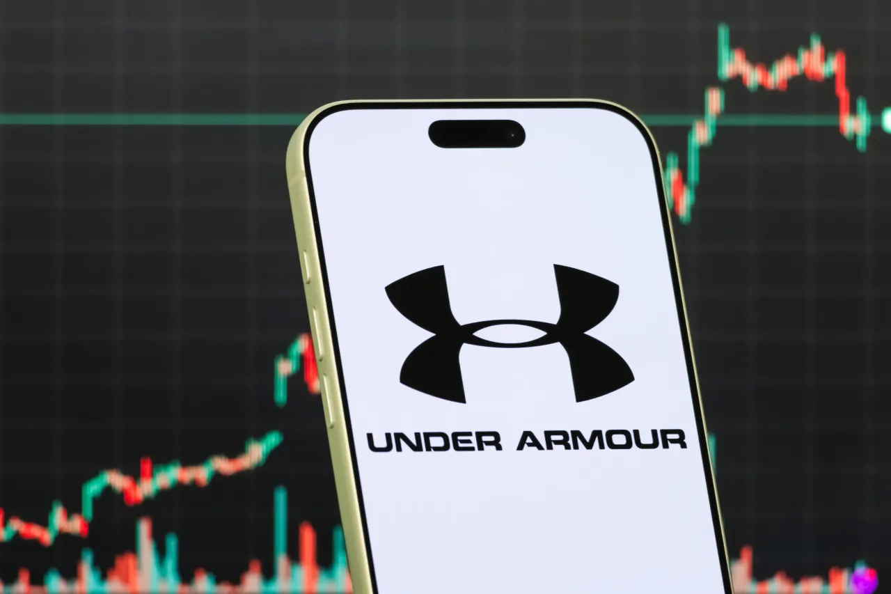 A smartphone displays the logo of Under Armour Inc. (Photo illustration by Cheng Xin/Getty Images)