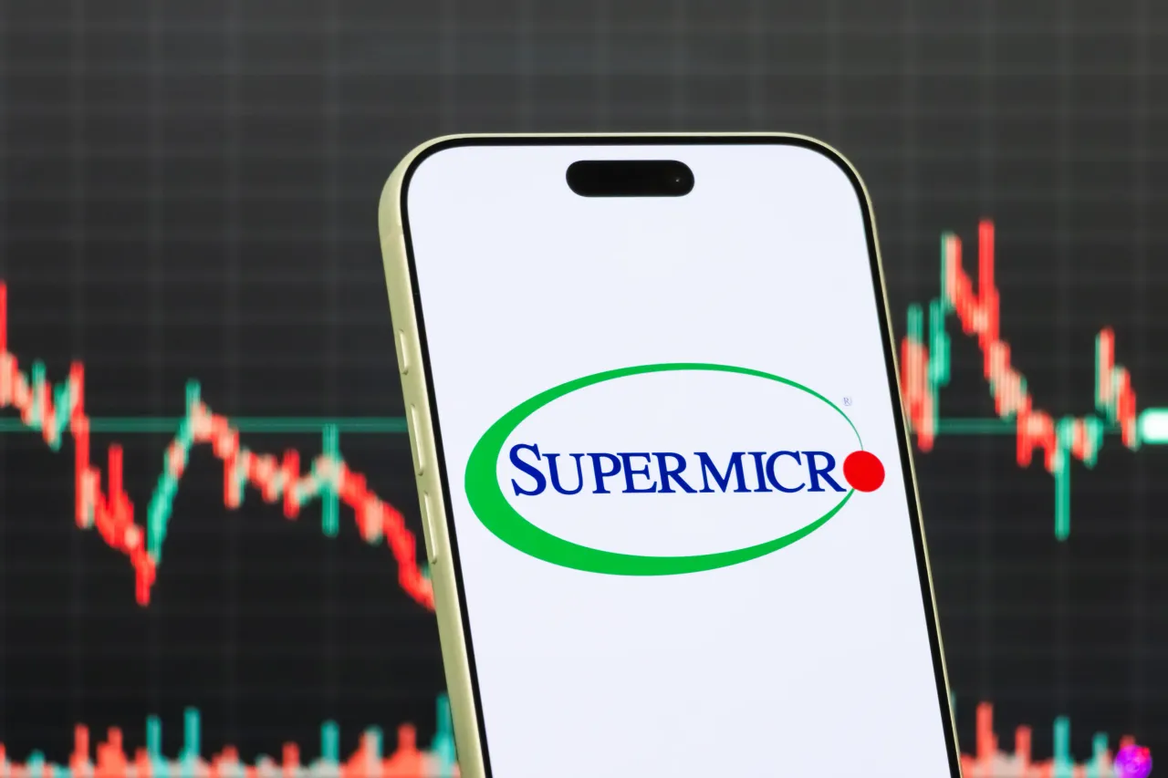 A smartphone displays the logo of Super Micro Computer, Inc. (Photo illustration by Cheng Xin/Getty Images)