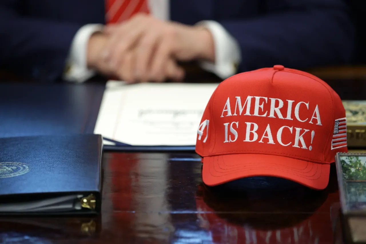 U.S. President Donald Trump (C) signs a bill in the Oval Office of the White House on February 03, 2026 in Washington, DC (Photo by Alex Wong/Getty Images)