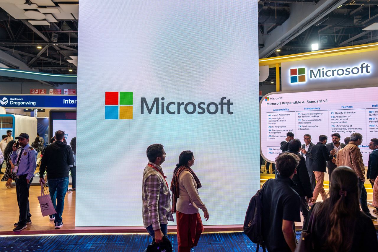 Visitors explore the Microsoft pavilion during the AI Impact Summit at Bharat Mandapam in New Delhi, India, on February 20, 2026. (Photo by Amarjeet Kumar Singh/Anadolu via Getty Images)