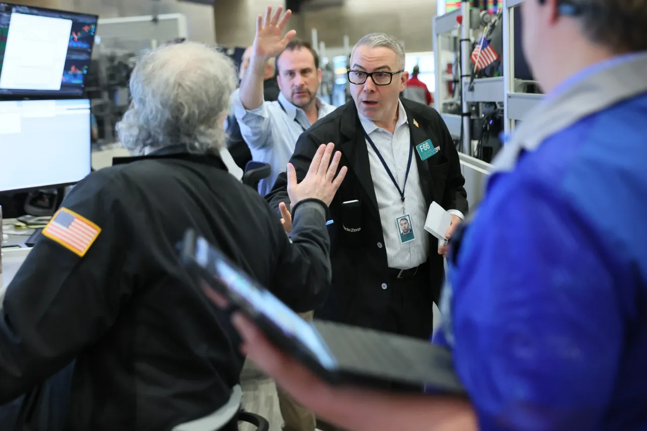 Traders work on the floor of the New York Stock Exchange during afternoon trading on February 20, 2026 in New York City. (Photo by Michael M. Santiago/Getty Images)