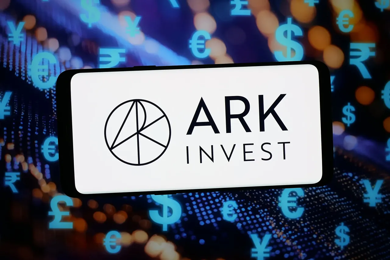 In this photo illustration, the logo of US company ARK Investment Management LLC is displayed on a smartphone in front of abstract background on computer screen. (Photo Illustration by Timon Schneider/SOPA Images/LightRocket via Getty Images)