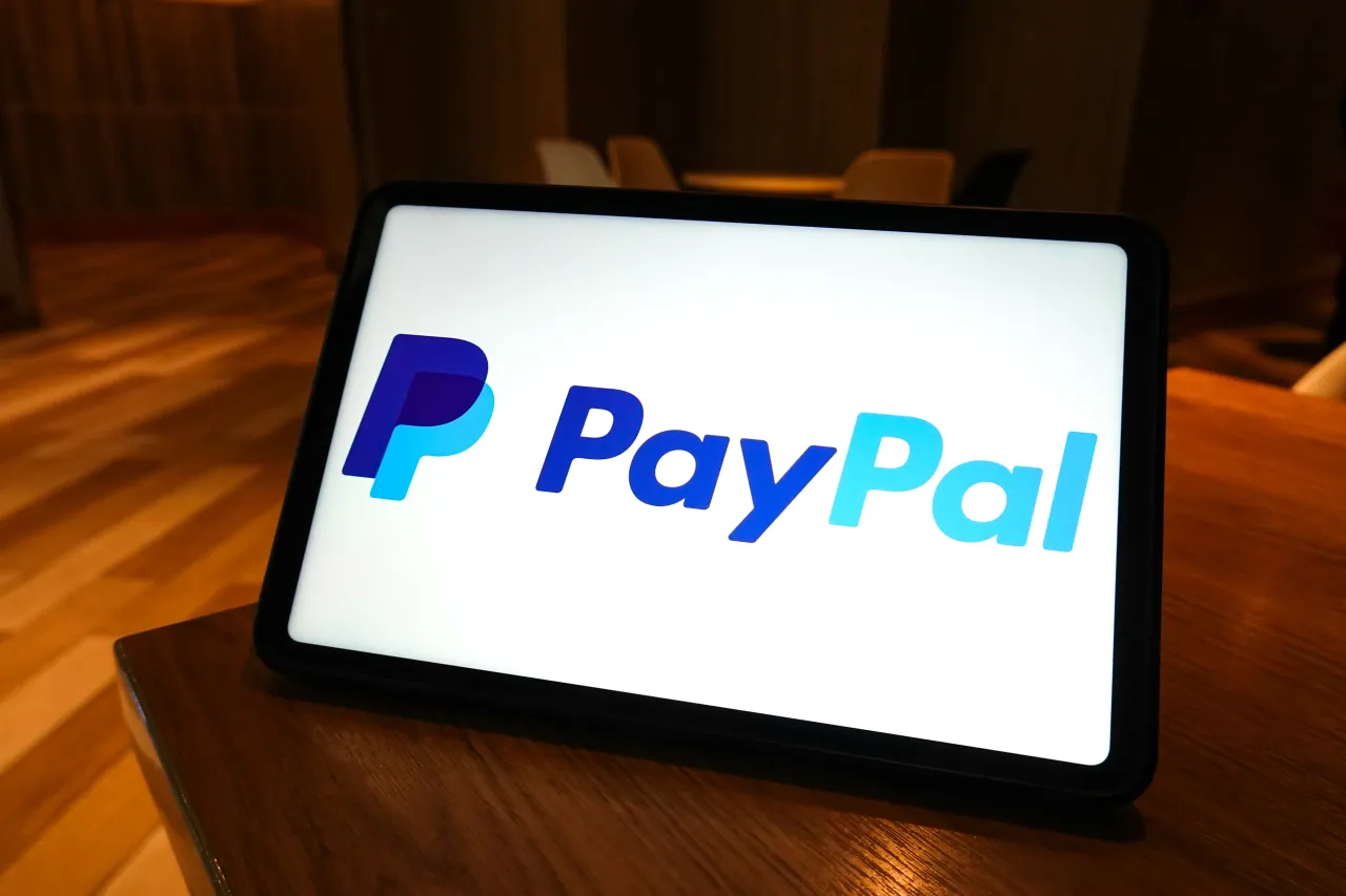 In this photo illustration, the PayPal logo is displayed on the screen of a smart tablet. (Photo Illustration by Sheldon Cooper/SOPA Images/LightRocket via Getty Images)
