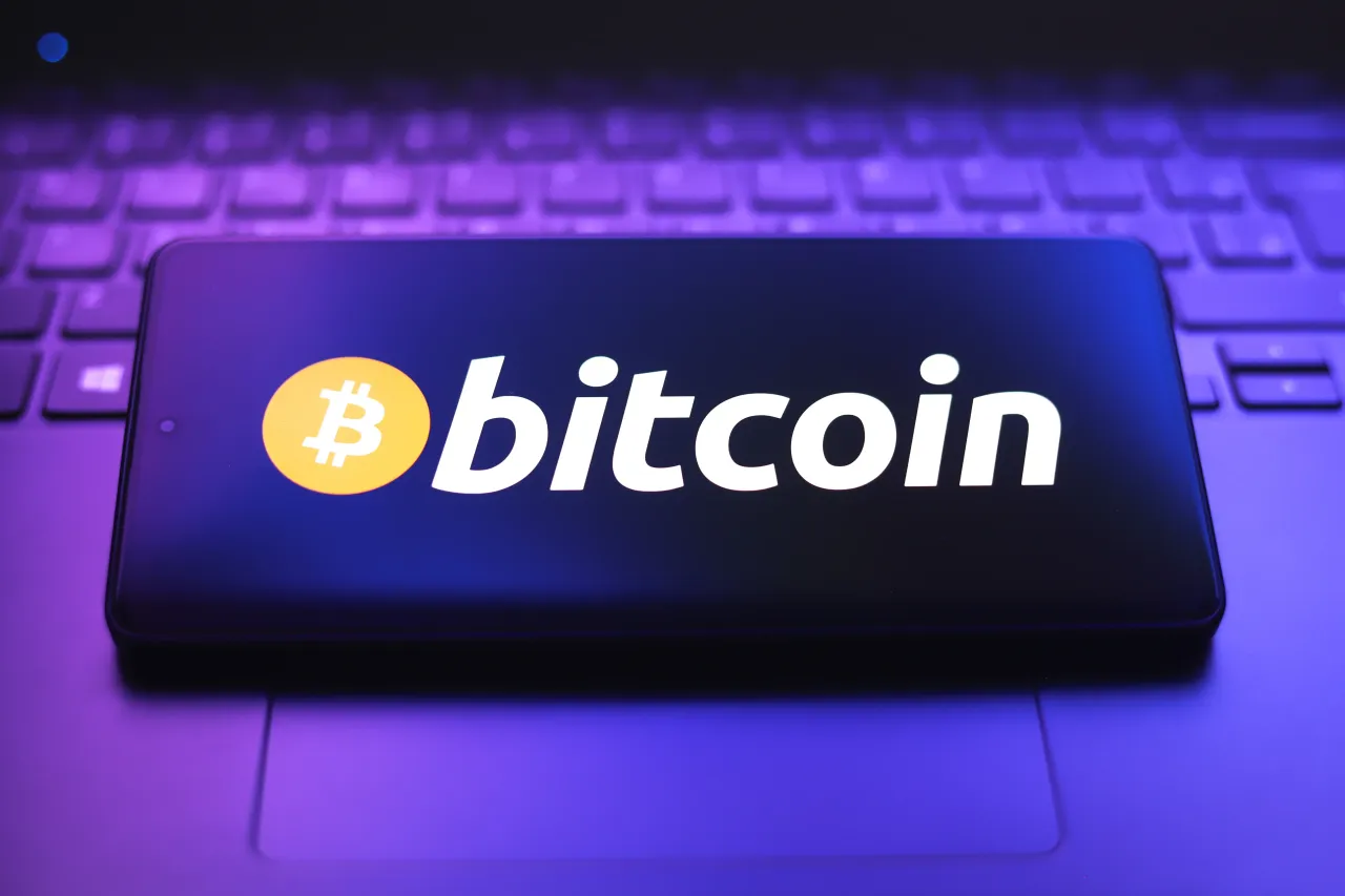 The Bitcoin logo appears on a smartphone screen in Ontario, Canada, on March 18, 2026. (Photo Illustration by Thomas Fuller/NurPhoto via Getty Images)
