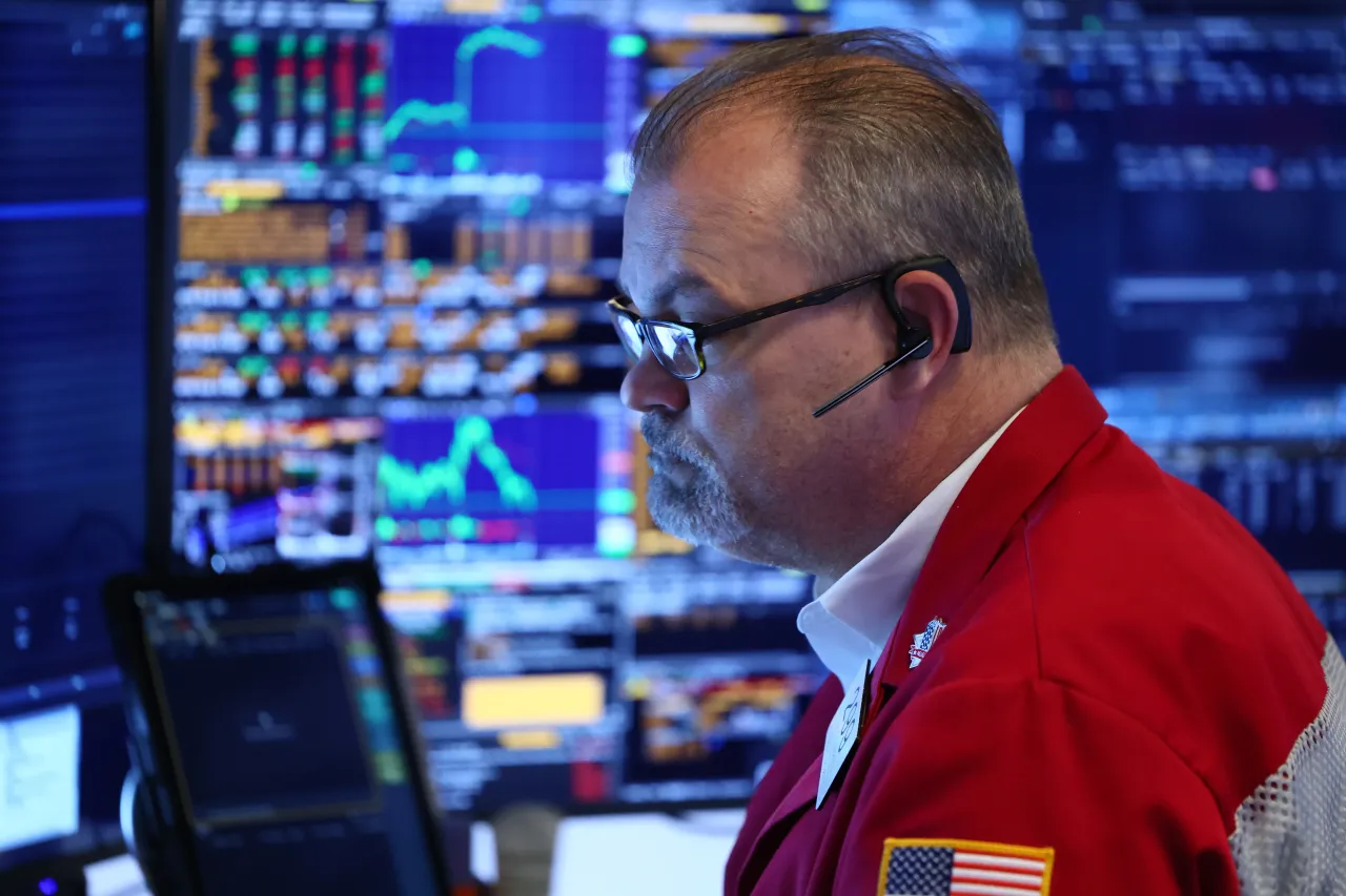 A trader works on the floor of the New York Stock Exchange. (Photo by Michael M. Santiago/Getty Images)