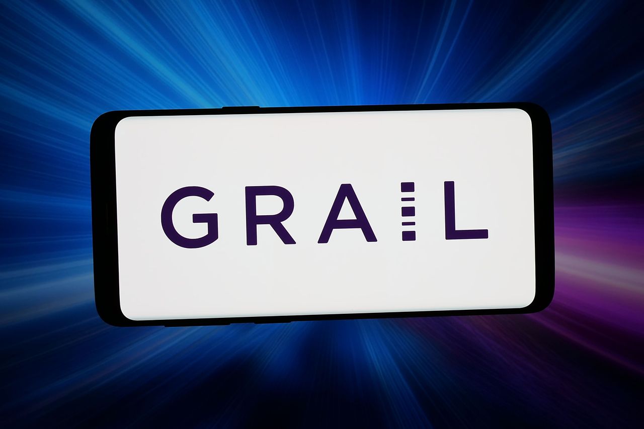 In this photo illustration, the logo of US biotechnology company GRAIL Inc. is displayed on a smartphone in front of abstract background on computer screen. (Photo Illustration by Timon Schneider/SOPA Images/LightRocket via Getty Images)