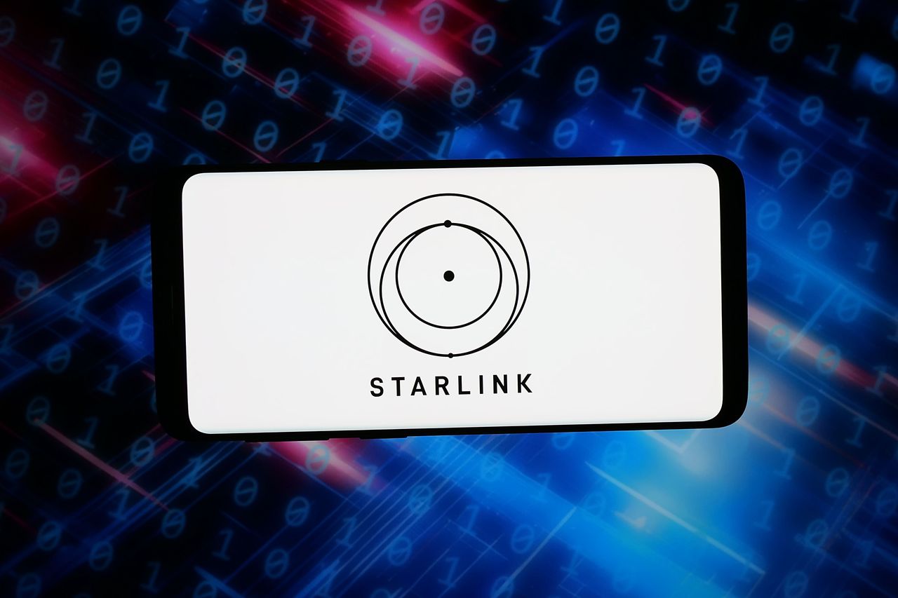 In this photo illustration, the logo of satellite company Starlink Services (SpaceX) is displayed on a smartphone. (Photo Illustration by Timon Schneider/SOPA Images/LightRocket via Getty Images)