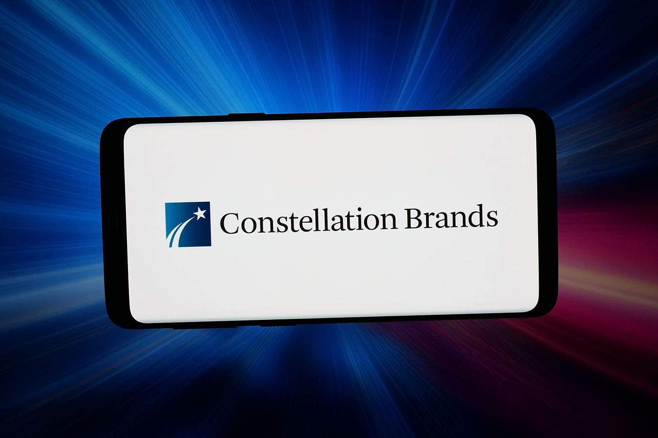 In this photo illustration, the logo of US beverage company Constellation Brands Inc. is displayed on a smartphone.