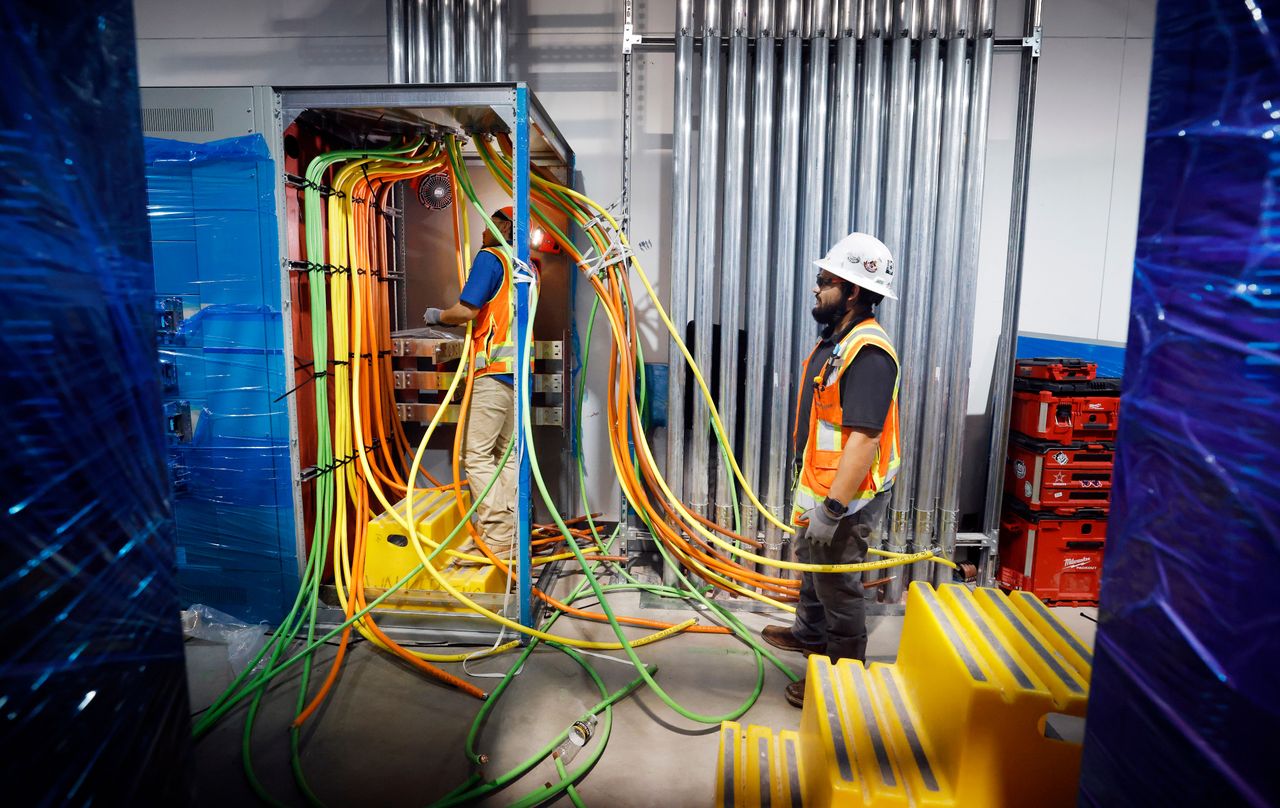 Construction workers wire electricity lines in a data center in Dallas, Texas on March 4, 2026. (Tom Fox/The Dallas Morning News via Getty Images)