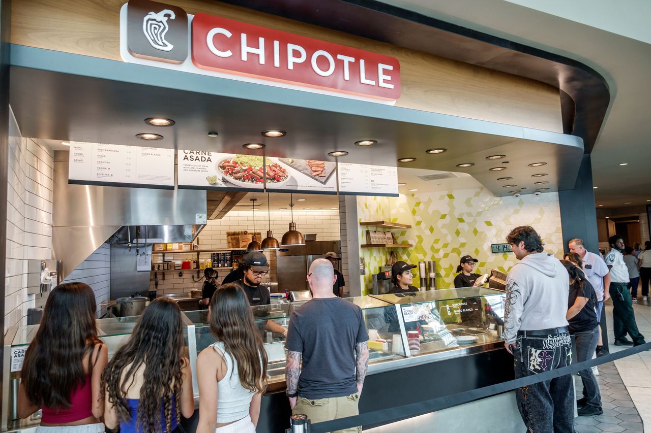 Chipotle Mexican Grill restaurant counter service line inside Aventura Mall, Miami, Florida.