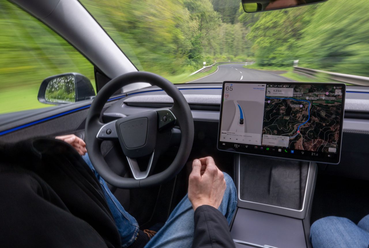 A self-driving Tesla Model Y is driving autonomously on the roads of the Eifel. Photo: Harald Tittel/dpa (Photo by Harald Tittel/picture alliance via Getty Images)