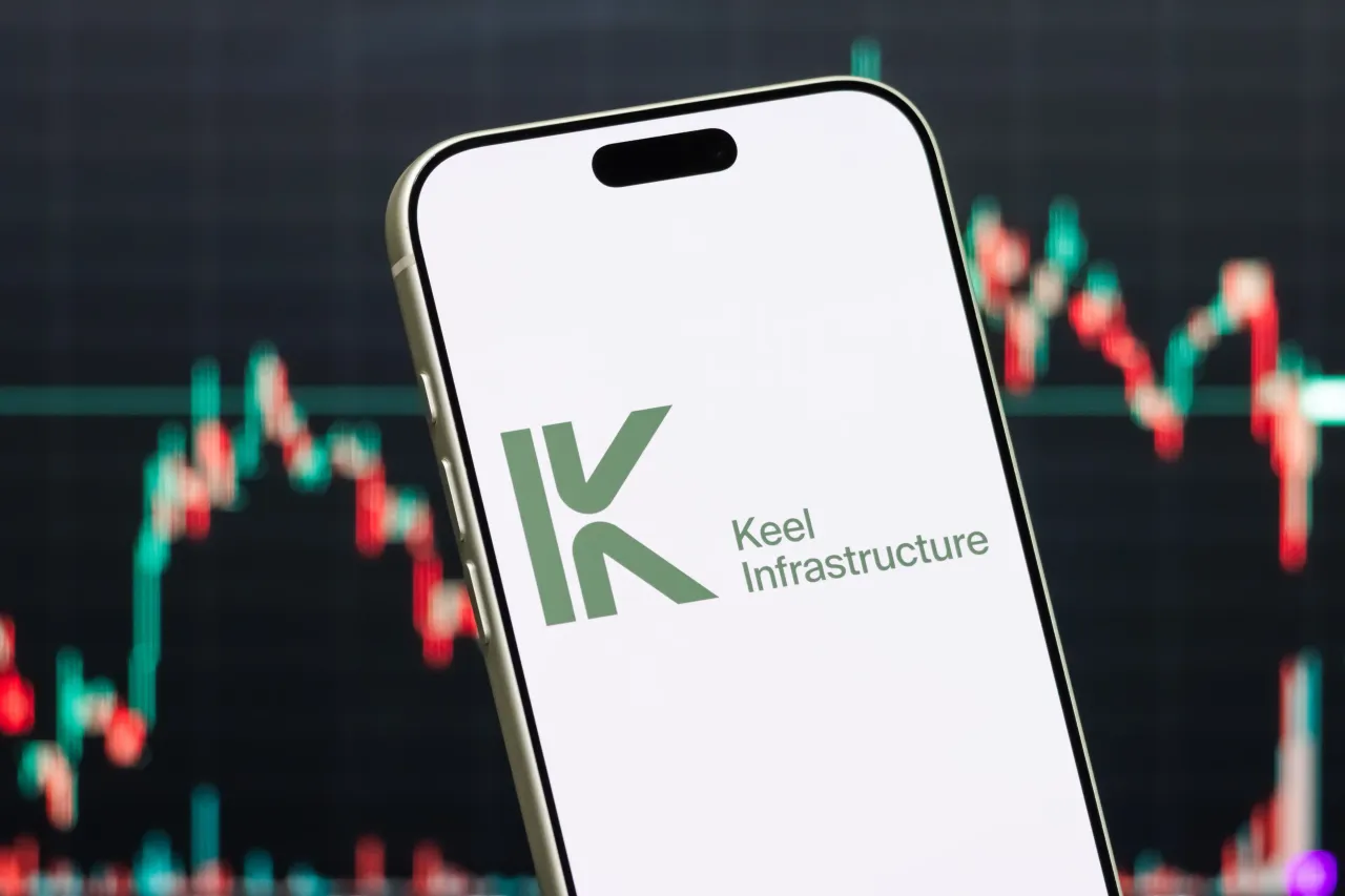 In this photo illustration, a smartphone displays the logo of Keel Infrastructure Corp. in front of a screen in Shenzhen, Guangdong Province, China. (Photo illustration by Cheng Xin/Getty Images)