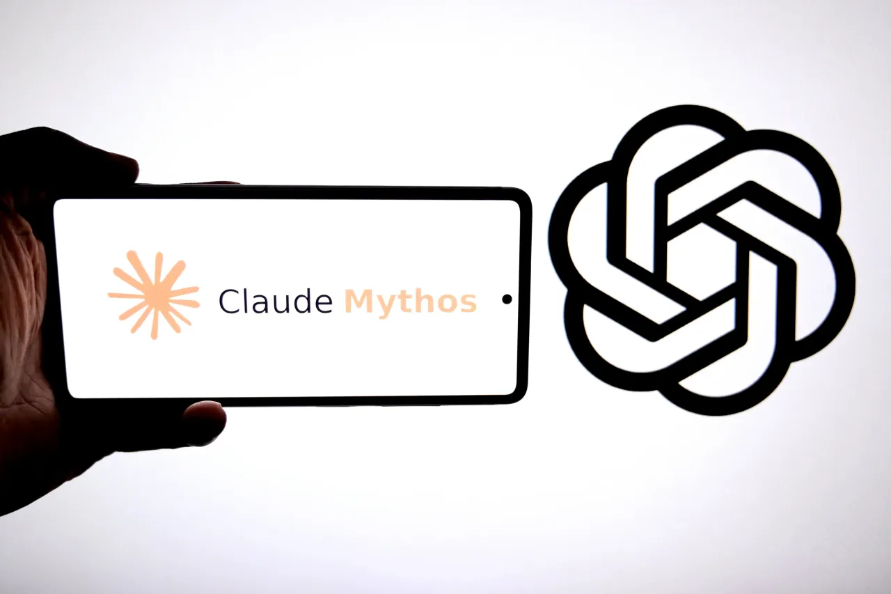 A Claude mythos logo is seen displayed on a smartphone with a Chatgpt logo in the background. (Photo Illustration by Avishek Das/SOPA Images/LightRocket via Getty Images)