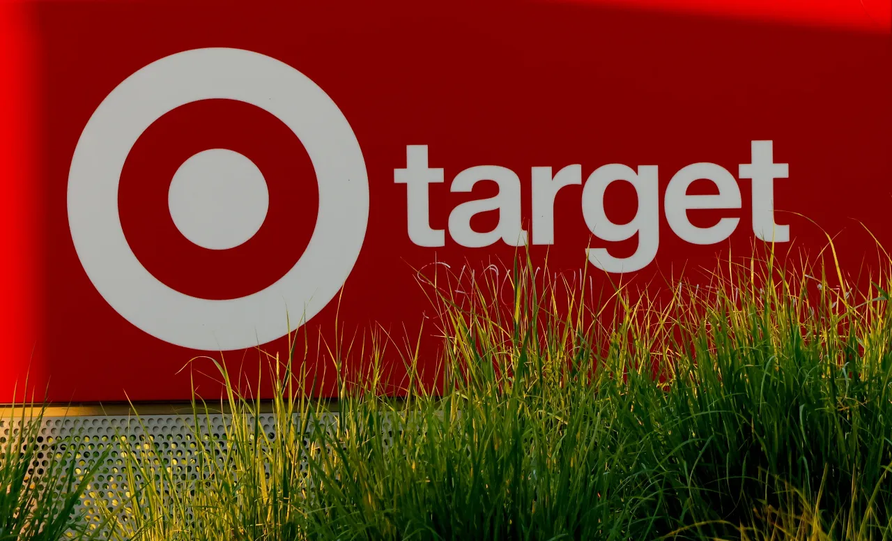 The rising sun illuminates the Target corporate logo on a sign at a store on May 19, 2026, in Jersey City, New Jersey.