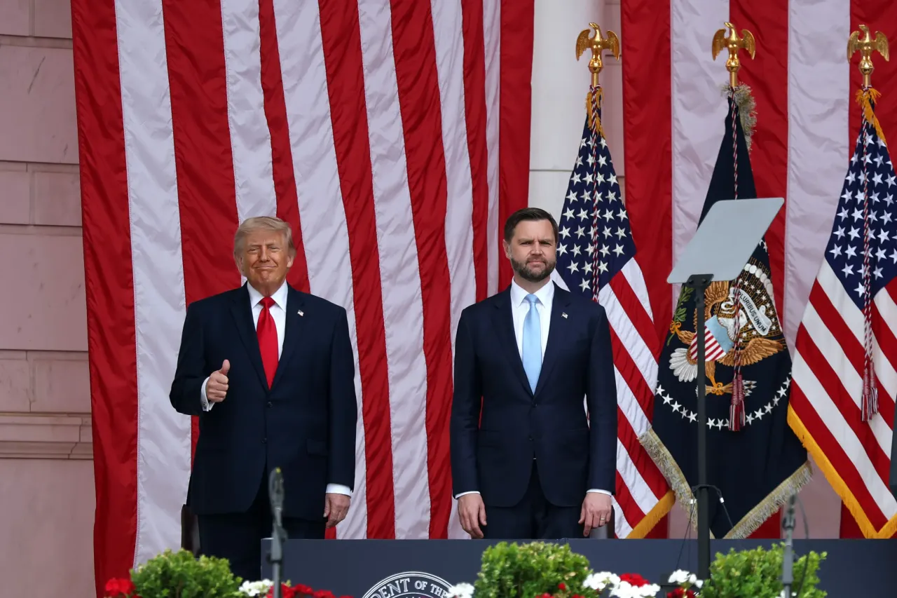 President Donald Trump and Vice President JD Vance stand onstage during a Memorial Day ceremony at Arlington National Cemetery on May 25, 2026 in Arlington, Virginia. (Photo by Kevin Dietsch/Getty Images)
