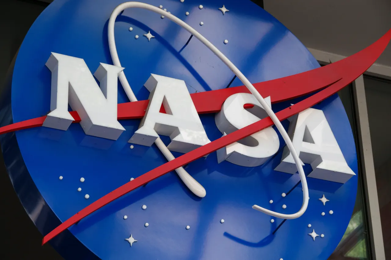 A NASA logo is displayed at the entrance to the Mary W. Jackson NASA Headquarters building on May 30, 2026 in Washington, DC. (Photo by Kevin Carter/Getty Images)