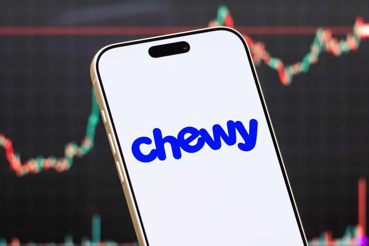 In this photo illustration, a smartphone displays the logo of Chewy, Inc.