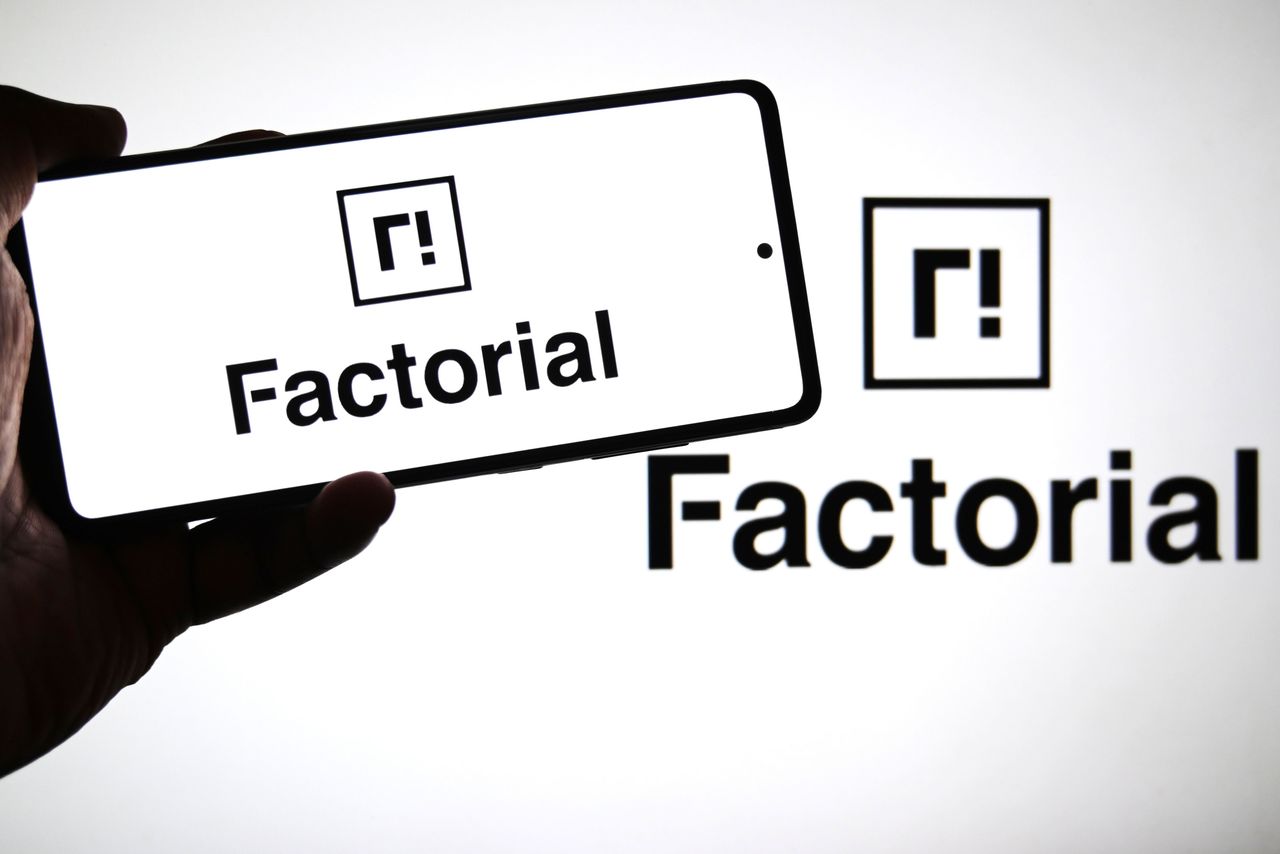 In this photo illustration, a Factorial Energy logo is seen displayed on a smartphone and in the background. (Photo Illustration by Avishek Das/SOPA Images/LightRocket via Getty Images)