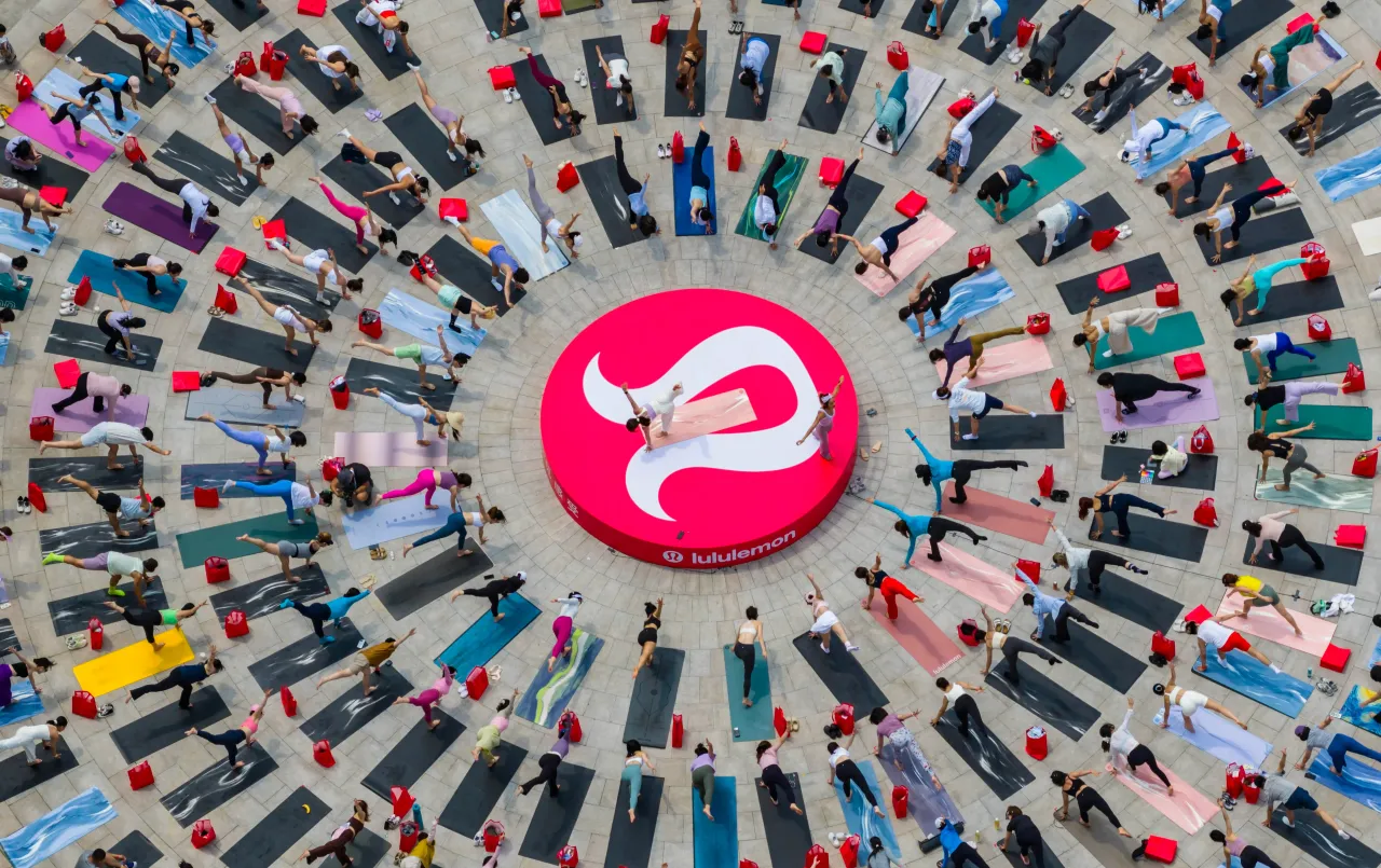Hundreds of yoga enthusiasts practice yoga at the Sun Square of Shenyang Grand Theatre in Shenyang, Liaoning Province of China.