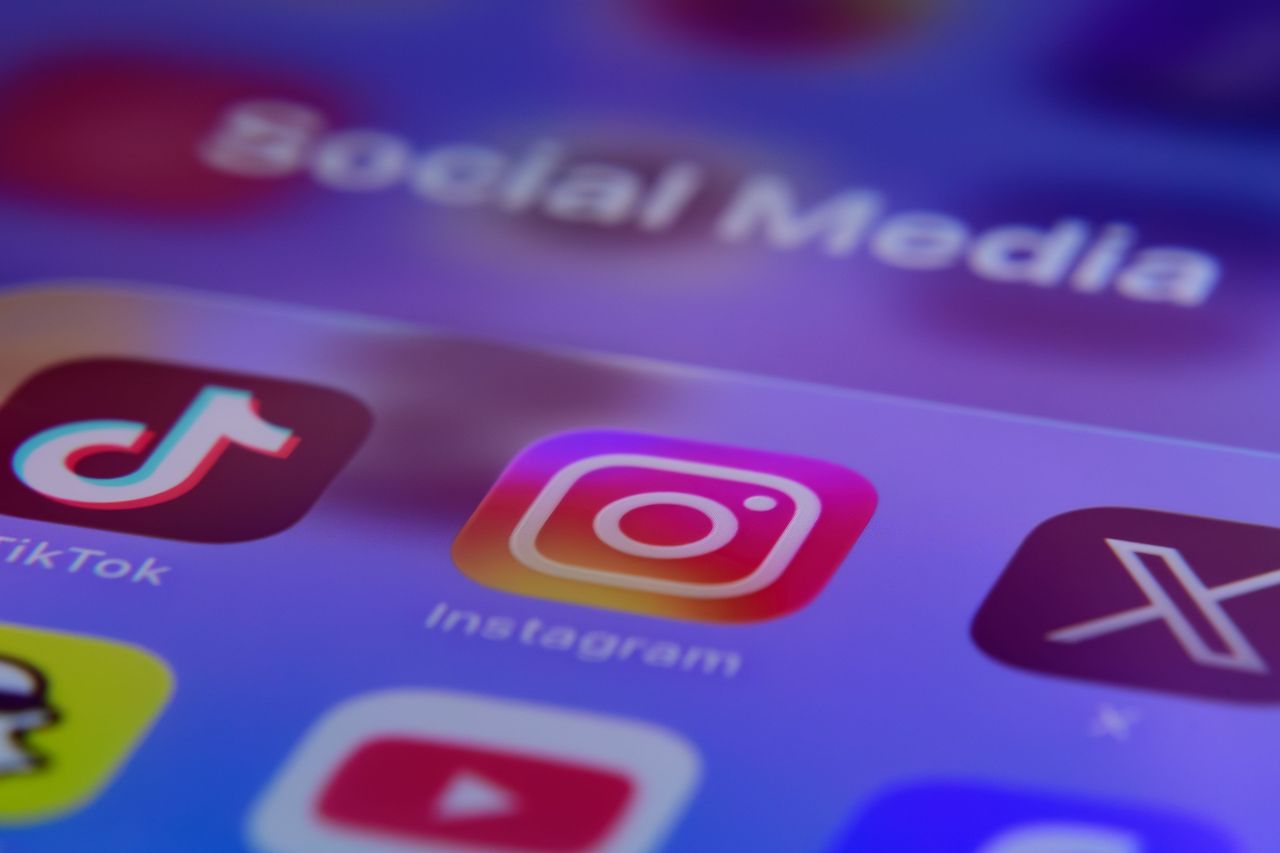 A folder of social media applications, including TikTok, Instagram, X (formerly Twitter), Snapchat, YouTube, and Facebook, is displayed on a smartphone screen. (Photo by Samuel Boivin/NurPhoto via Getty Images)
