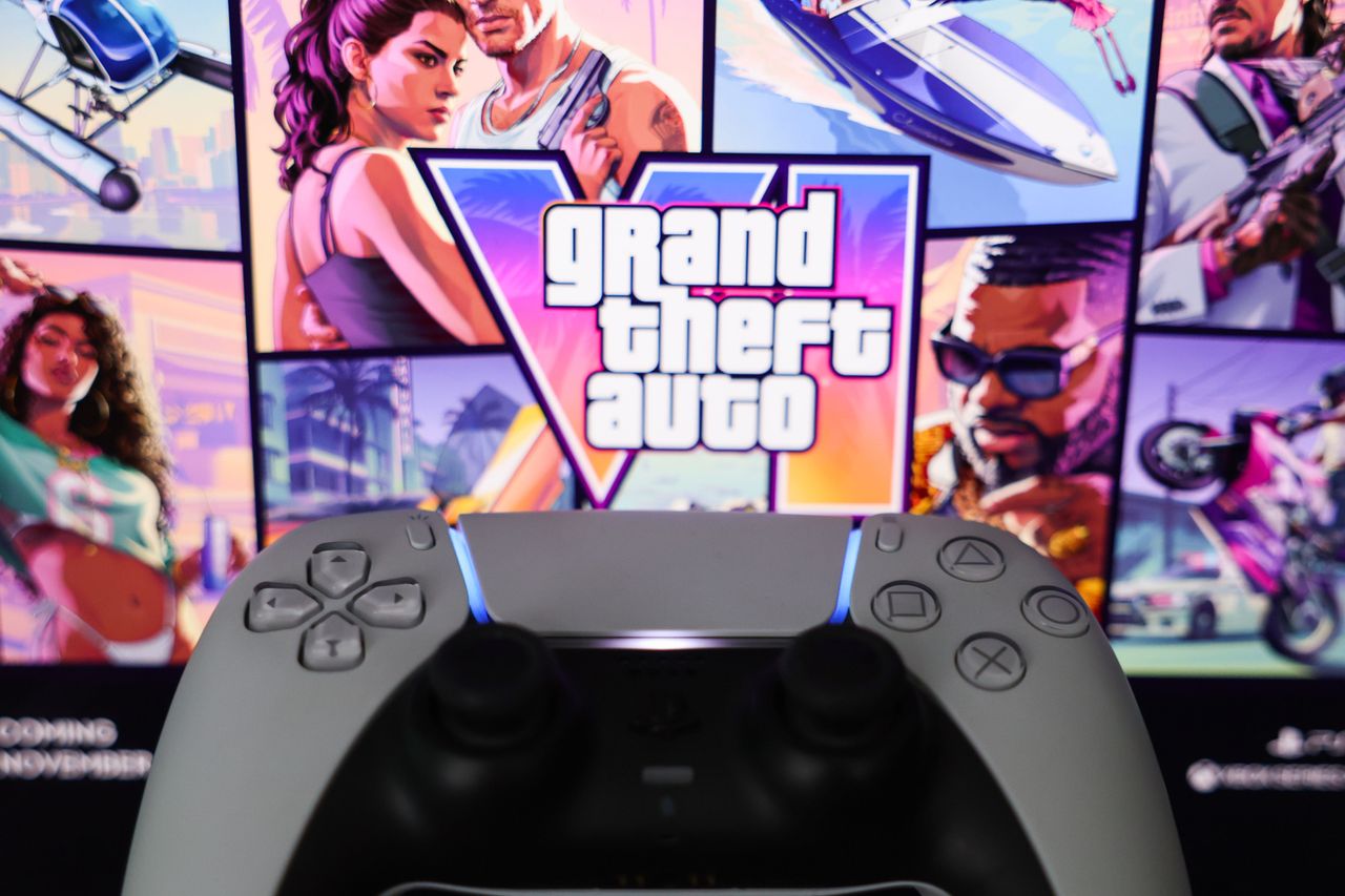 GTA VI website dislplayed on a screen and PlayStation DualSense controller are seen in this illustration photo.