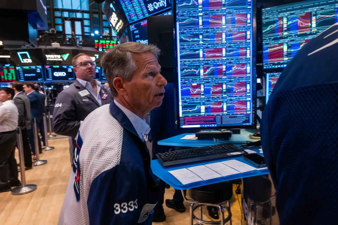 People work on the floor of the New York Stock Exchange (NYSE) on July 07, 2026 in New York City. (Photo by Spencer Platt/Getty Images)