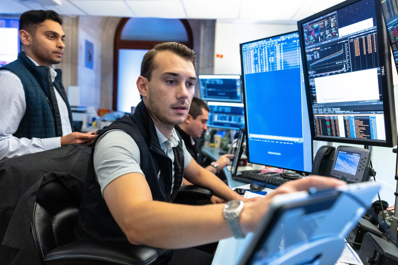 Traders work on the floor of the New York Stock Exchange. (Photo by Michael M. Santiago/Getty Images)
