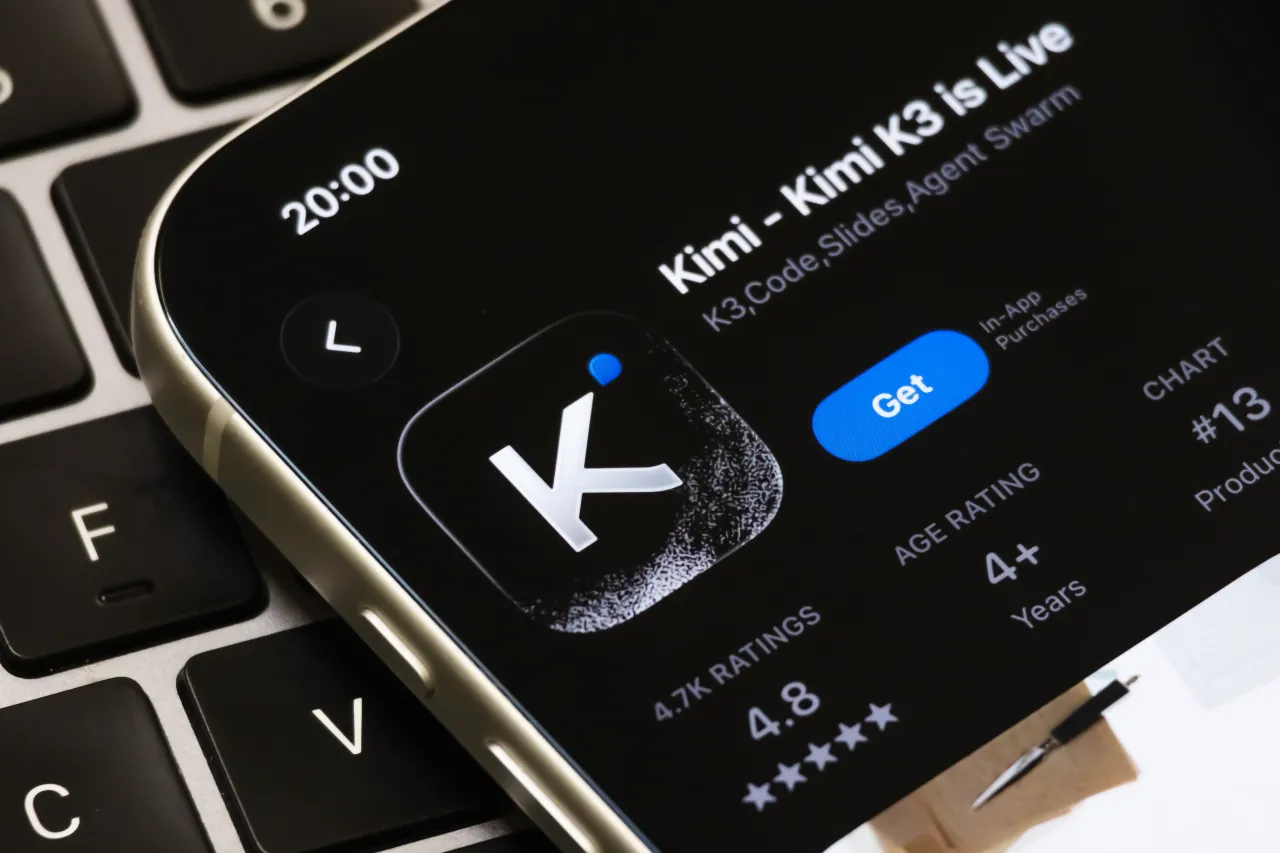 Kimi app page on Apple's App Store rests on a laptop keyboard on July 18, 2026. (Photo illustration by Cheng Xin/Getty Images)
