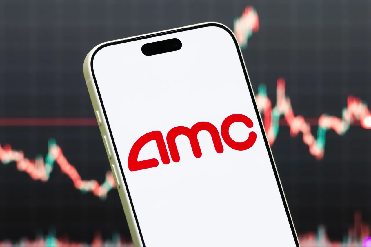 In this photo illustration, a smartphone displays the logo of AMC Entertainment Holdings, Inc.