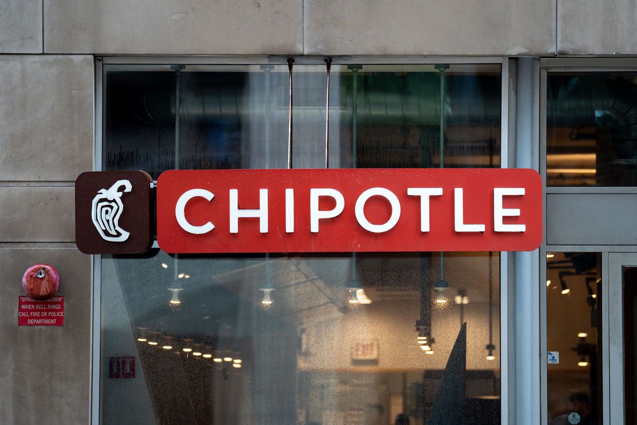 A sign displaying the logo of the fast casual restaurant chain Chipotle is seen in Chicago, Illinois, United States.