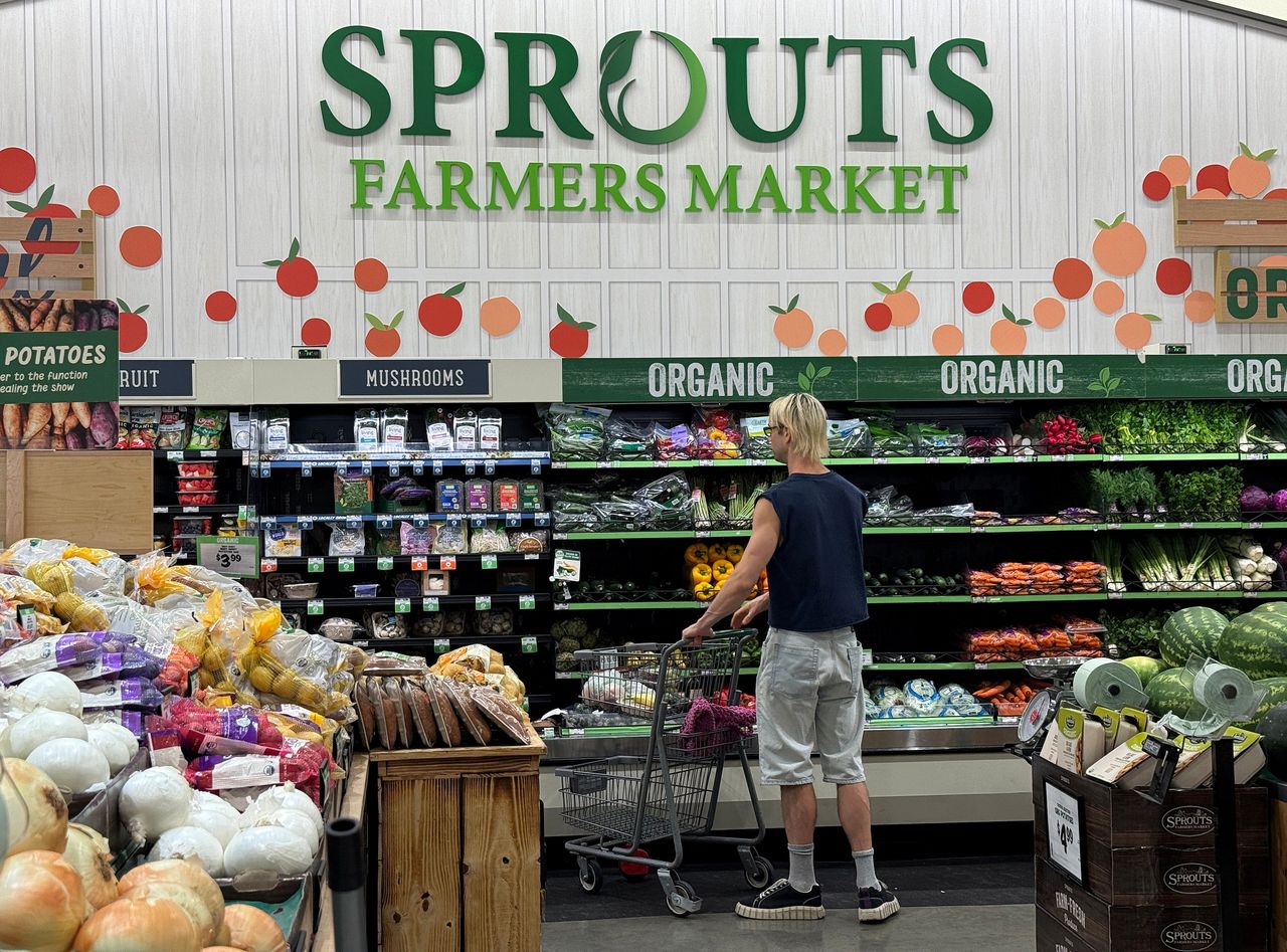 The Sprouts Farmers Market logo is displayed in the produce section of a Sprouts store.