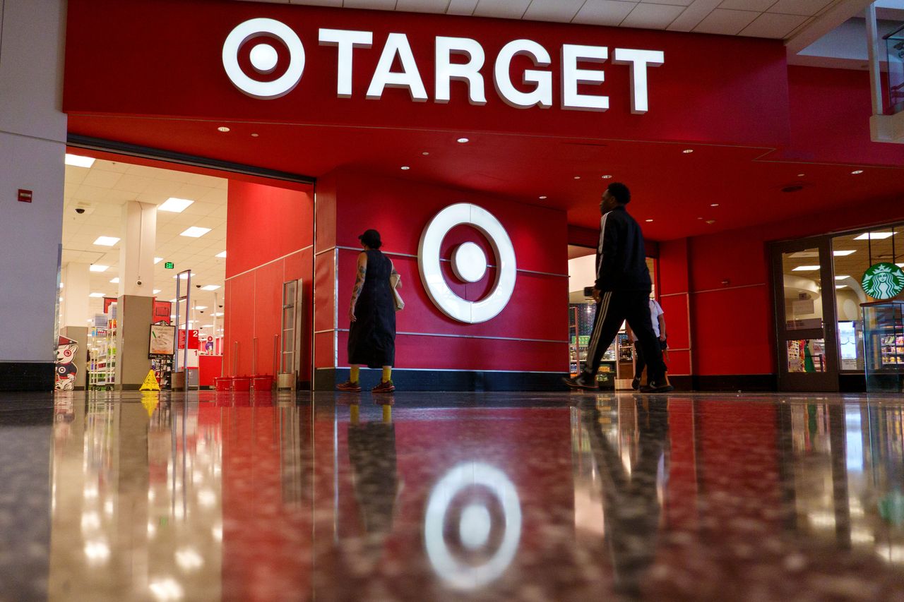 Shoppers walk past the entrance to a Target store in Washington, DC.