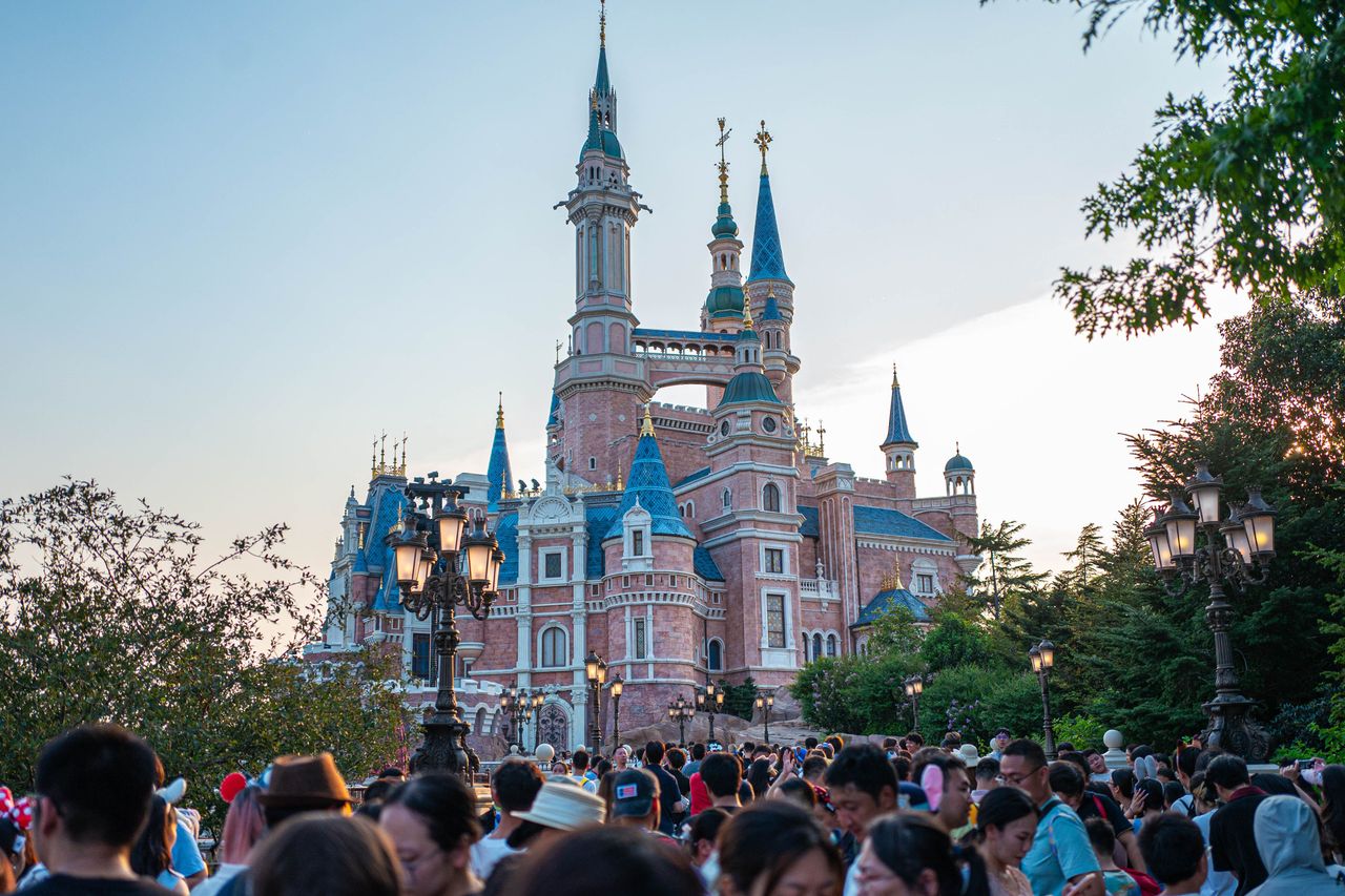Tourists visit Shanghai Disney Resort on August 1, 2026 in Shanghai, China. The theme park has seen a surge in visitor numbers during the summer season. (Photo by VCG/VCG via Getty Images)