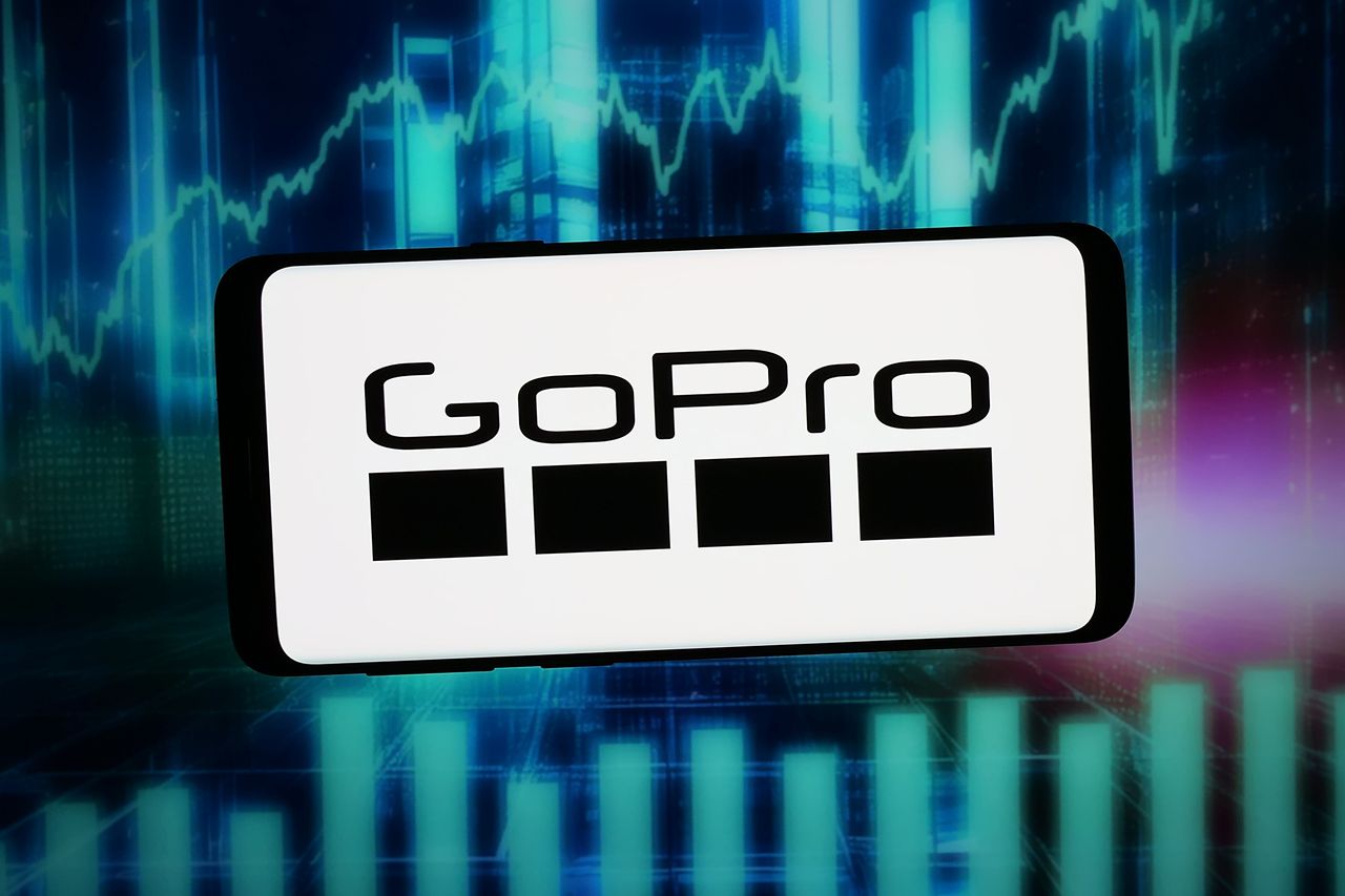 In this photo illustration, the logo of US action camera company GoPro Inc. is displayed on a smartphone.