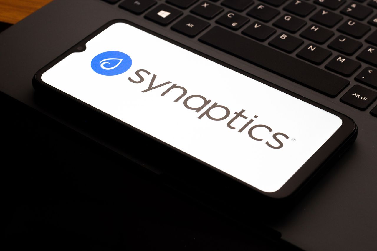 In this photo illustration, the Synaptics Incorporated logo is seen displayed on a smartphone screen. (Photo Illustration by Thomas Fuller/SOPA Images/LightRocket via Getty Images)