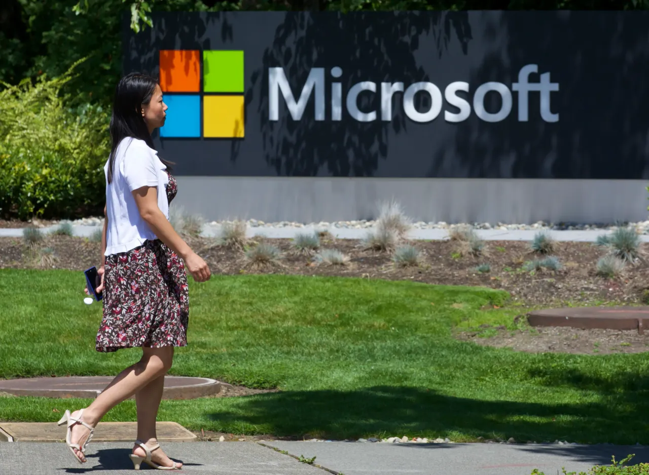 A pedestrian walks a sign on Microsoft Headquarters campus July 17, 2014 in Redmond, Washington. (Stephen Brashear/Getty Images)